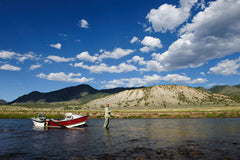 Drift boat wade fisherman